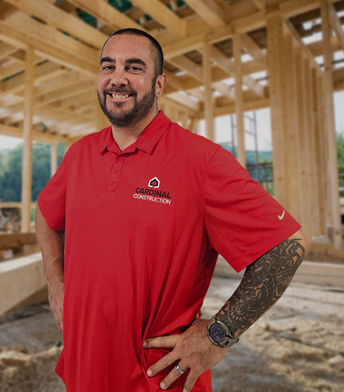 Owner of Cardinal Construction Florida standing in a home under construction