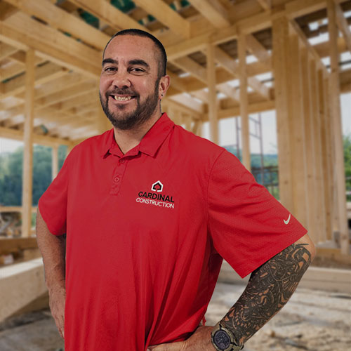 Cardinal Construction owner standing inside a home under construction