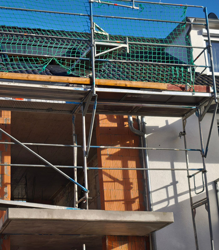 Bright and airy florida bedroom with ceiling fan, wood accents and large double patio doors